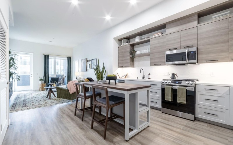 a kitchen with a dining table and chairs