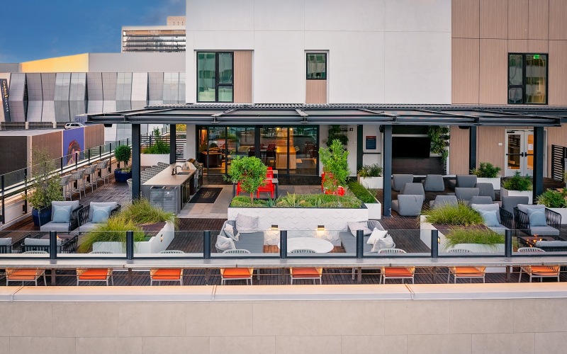 Rooftop Lounge with seating and grilling area
