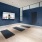 Yoga room with mats on floor and large TV