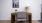 Desk with lamp and chair and art on the wall