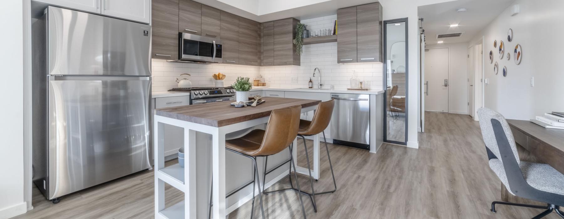 a kitchen with a table and chairs