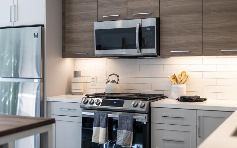 a kitchen with a stove and microwave